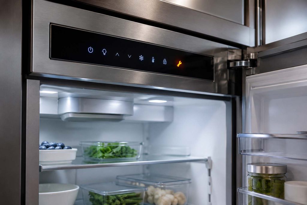Sub-Zero built-in refrigerator control panel with the service indicator lit